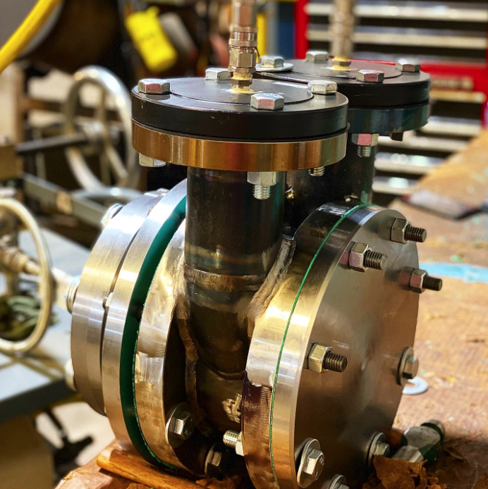 Emergency ASME Section VIII/nuclear safety-related reverse engineering of a heat exchanger return head.